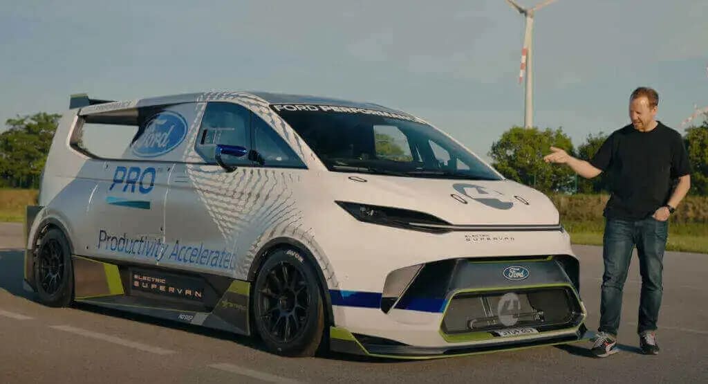 a man standing front of Ford Pro Electric Supervan 